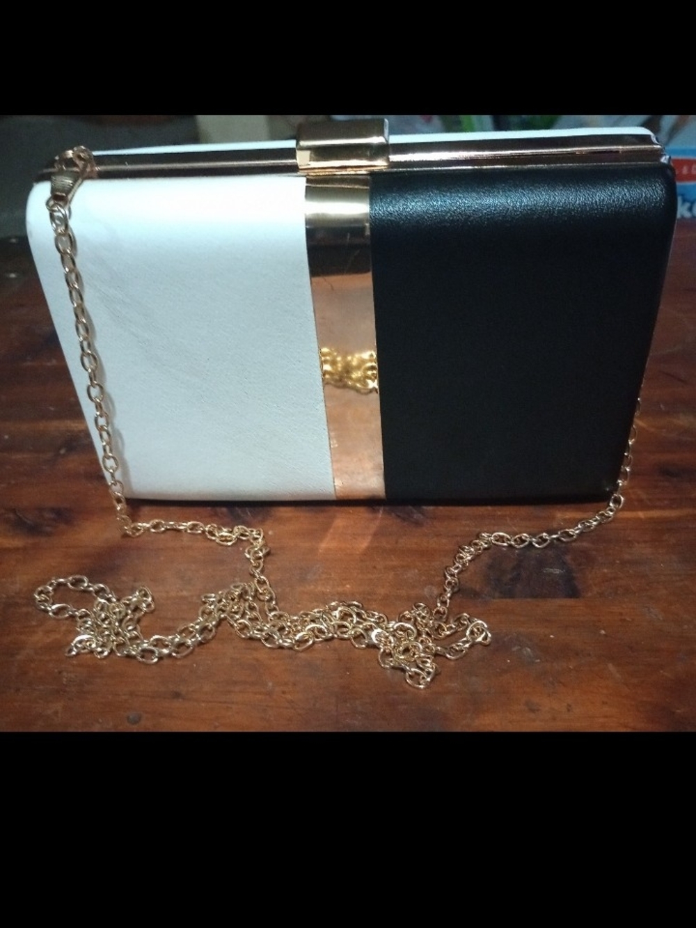 Elegant Black & White Clutch with Gold Accent